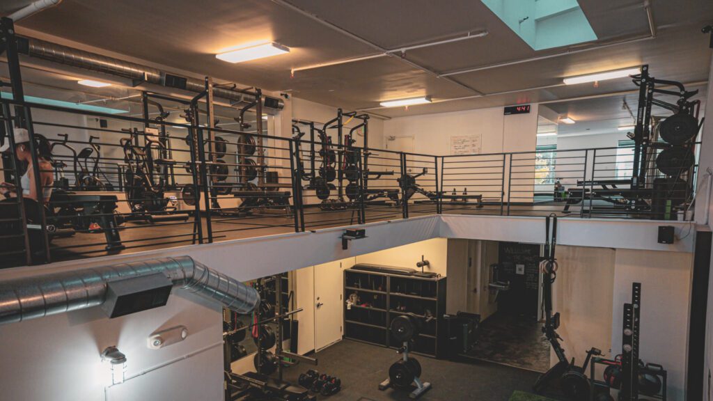 Our Bay Area Gyms: Wide angle of private gym pods over two floors